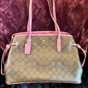 Coach Carryall in Signature Canvas with mauve pink accents.